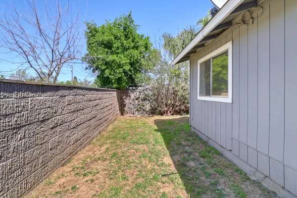 a view of house with backyard