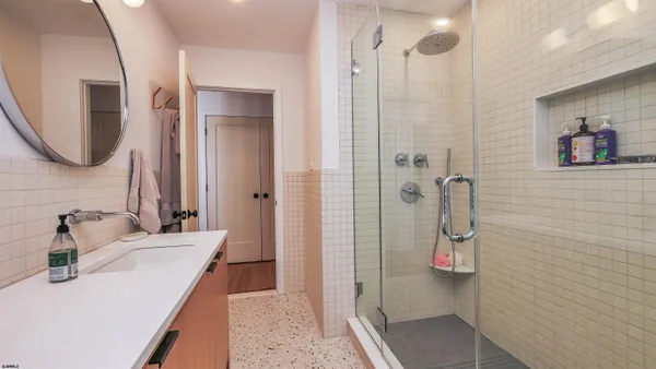 a bathroom with a sink and mirror