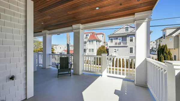 a view of a porch with wooden floor and outdoor space