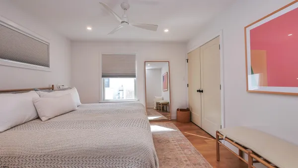 a room with a bed and a window