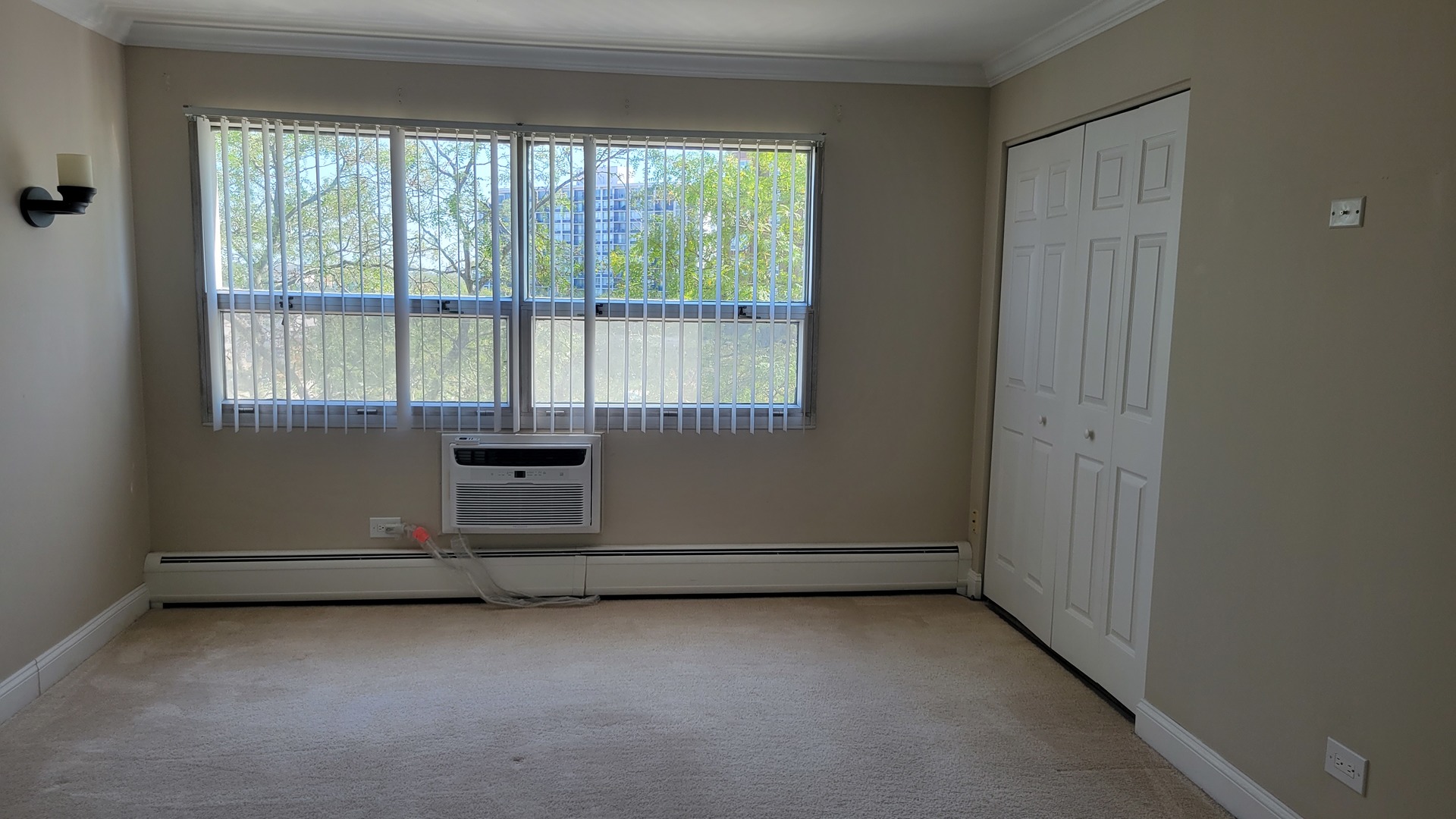 9001 West Golf Road, Unit 4B Des Plaines, IL 60016 - Photo 11 of 21 an empty room with a empty space and windows