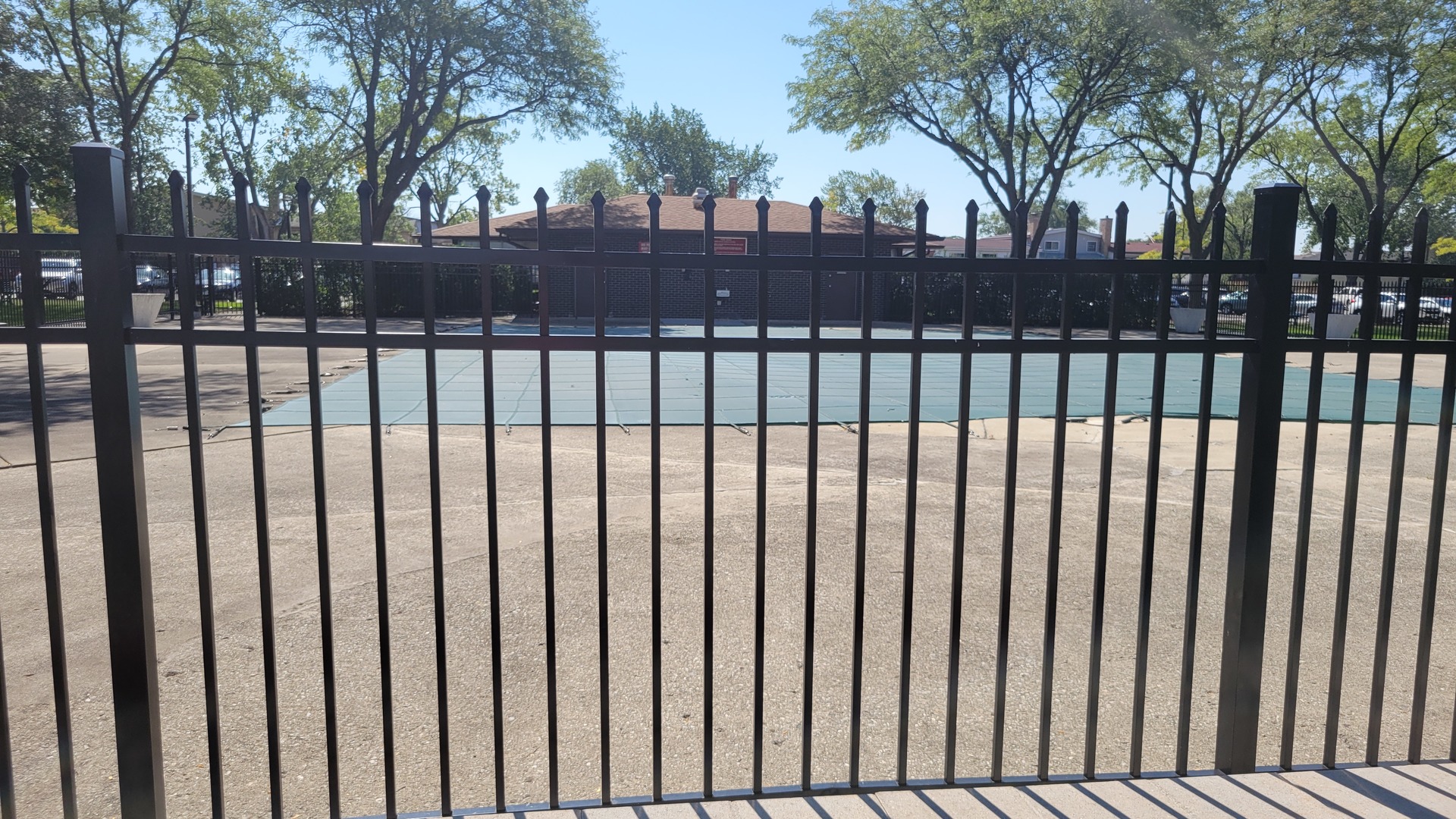 9001 West Golf Road, Unit 4B Des Plaines, IL 60016 - Photo 19 of 21 a view of a house with a wooden fence