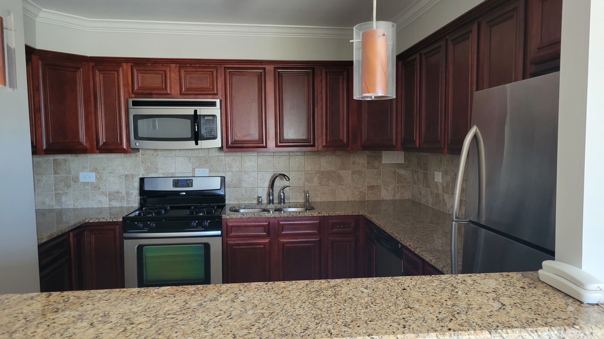 9001 West Golf Road, Unit 4B Des Plaines, IL 60016 - Photo 6 of 21 a kitchen with a refrigerator stove and microwave