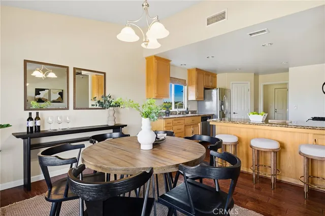a large kitchen with a sink and cabinets