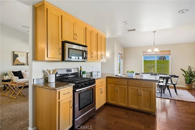 a kitchen with a refrigerator and a sink