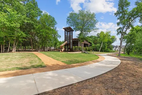an aerial view of a house with yard swimming pool and outdoor seating