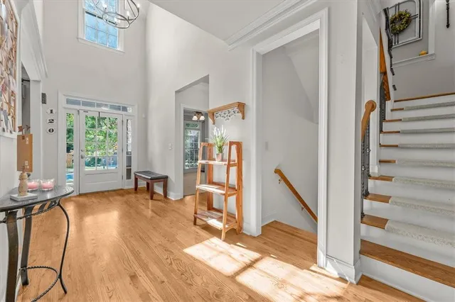 a view of a livingroom with wooden floor and furniture
