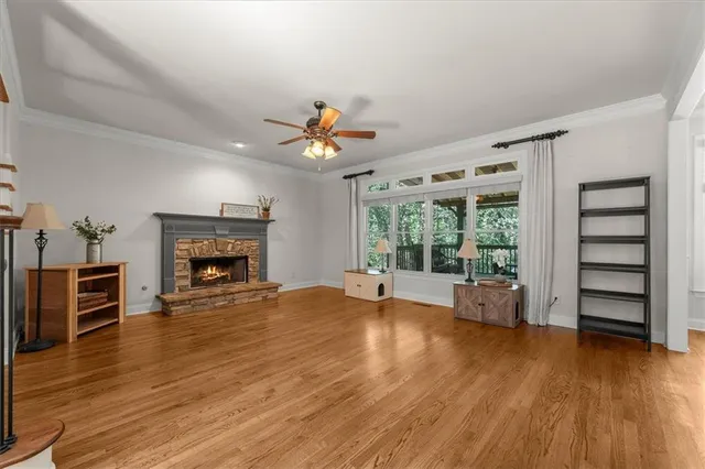 a view of livingroom with furniture fire place and window