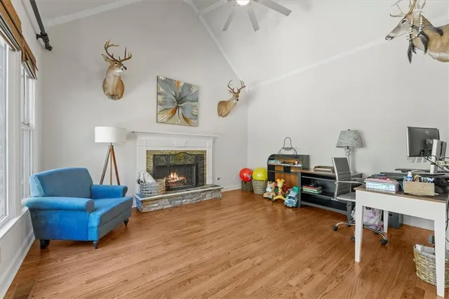 a living room with furniture and a fireplace