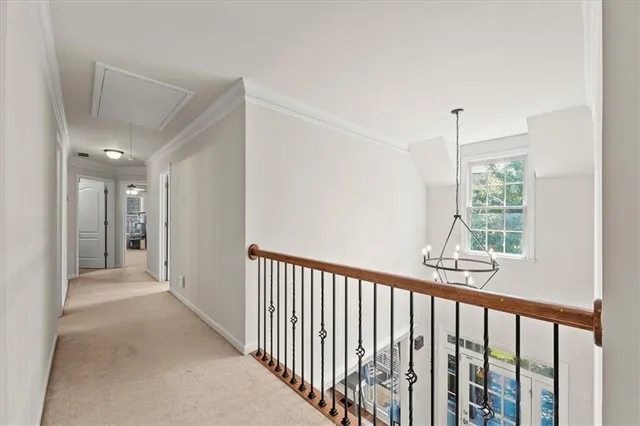 a view of a hallway with windows