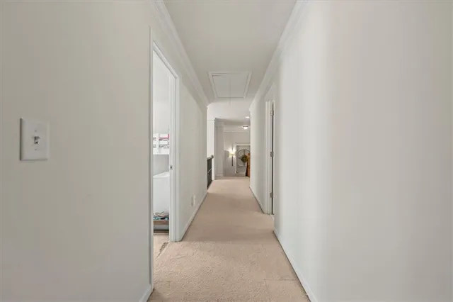 a view of a hallway with a white walls