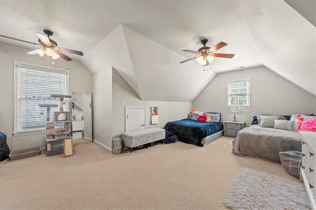 a bed room with a bed and a chandelier