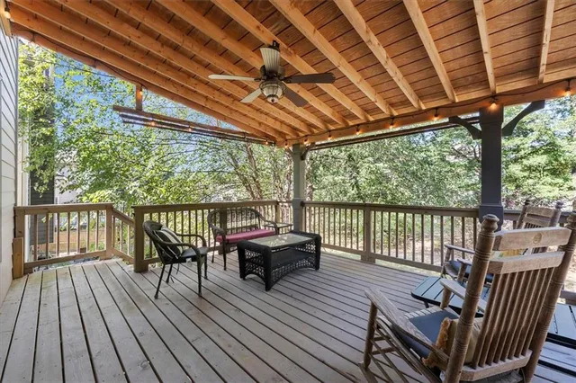a view of house with a yard and sitting area