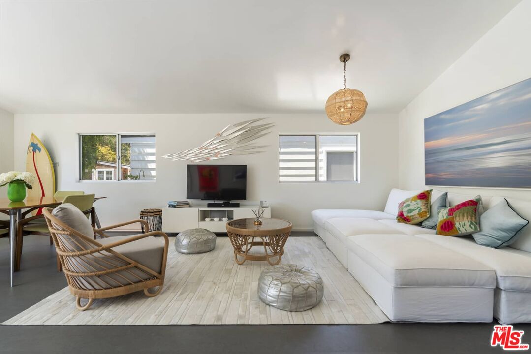 29 Paradise Cove Road Malibu, CA 90265 - Photo 1 of 33 a living room with furniture a flat screen tv and a window