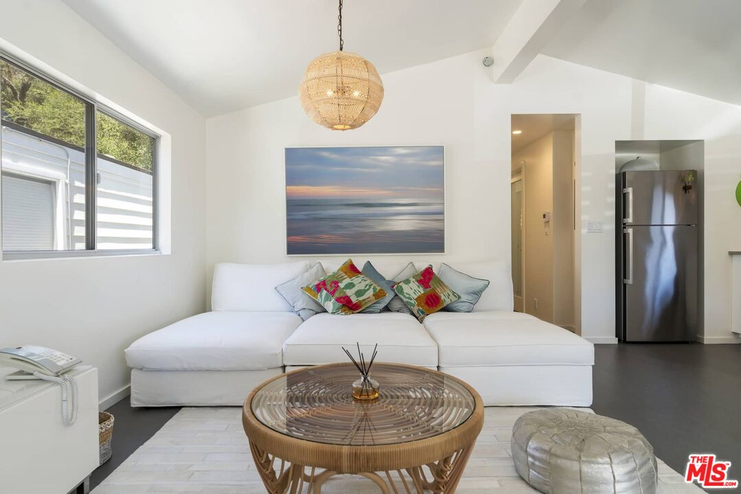 29 Paradise Cove Road Malibu, CA 90265 - Photo 11 of 33 a living room with furniture and a table
