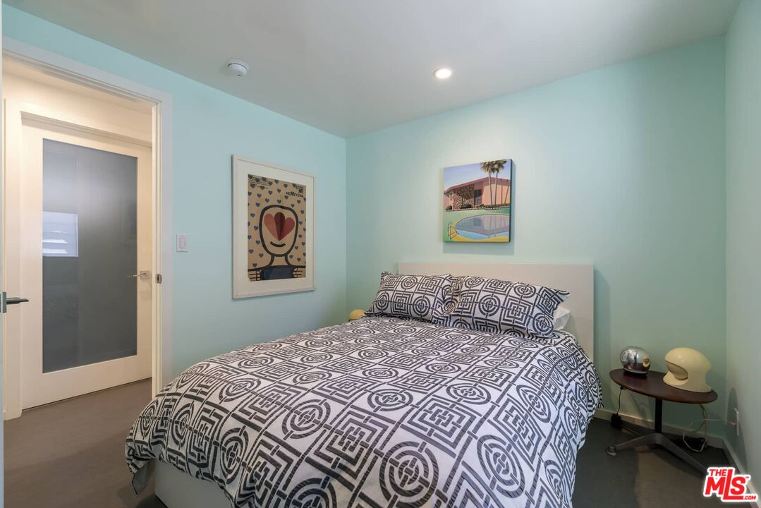 29 Paradise Cove Road Malibu, CA 90265 - Photo 12 of 33 a bedroom with a bed and painting on the wall