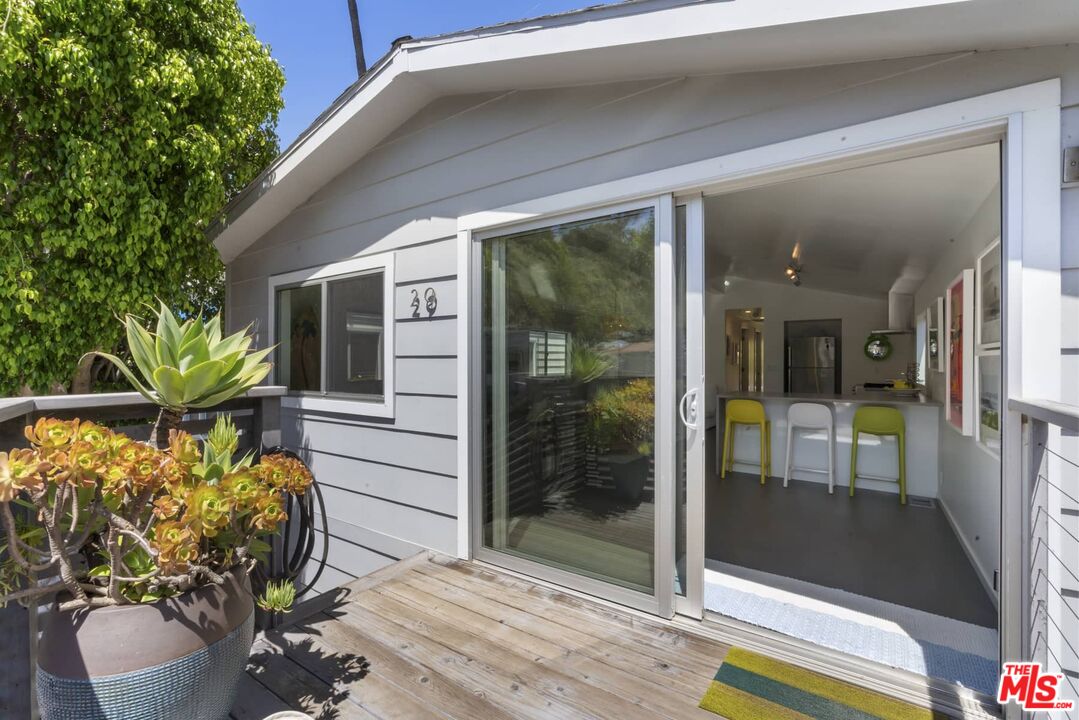 29 Paradise Cove Road Malibu, CA 90265 - Photo 2 of 33 a front view of a house with outdoor seating