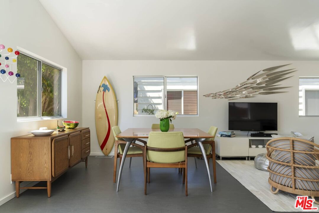 29 Paradise Cove Road Malibu, CA 90265 - Photo 4 of 33 a view of a livingroom with furniture and a flat screen tv