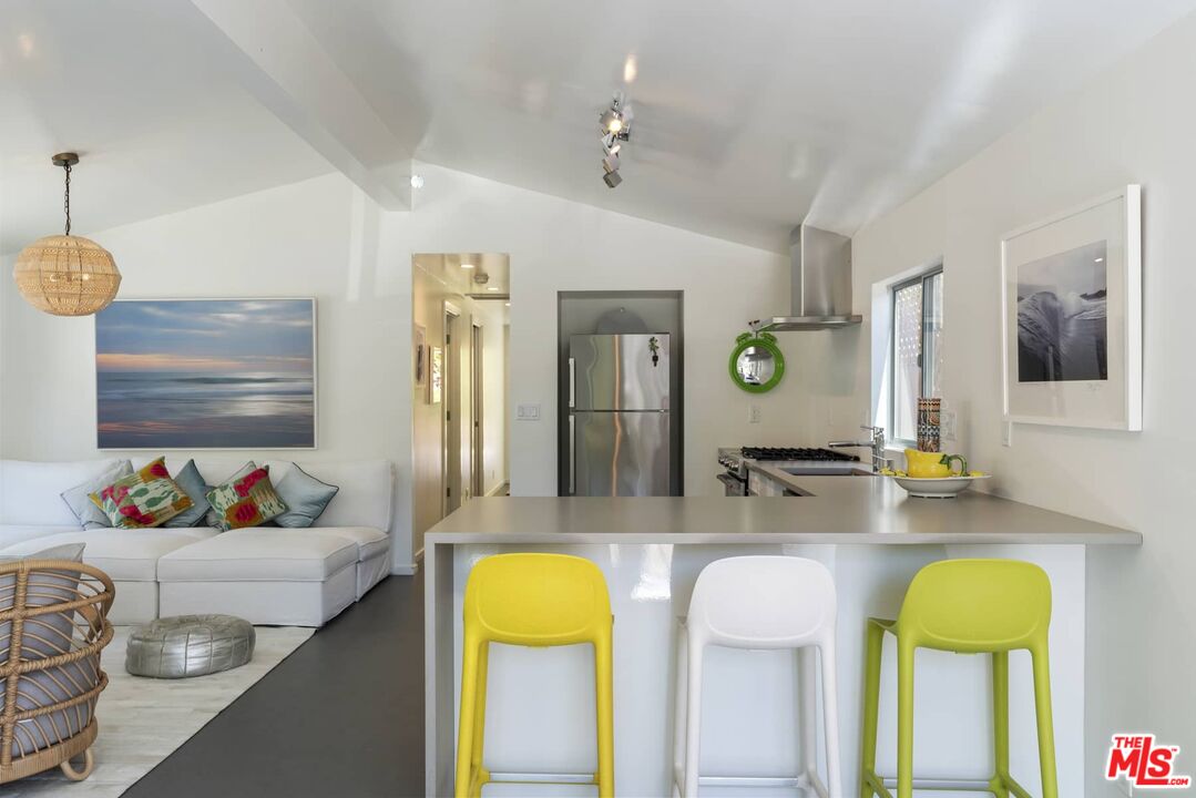 29 Paradise Cove Road Malibu, CA 90265 - Photo 7 of 33 a kitchen with a refrigerator and a sink