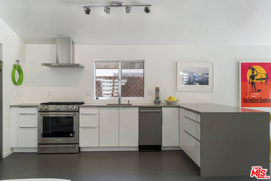 29 Paradise Cove Road Malibu, CA 90265 - Photo 9 of 33 a kitchen with granite countertop cabinets stainless steel appliances and a window