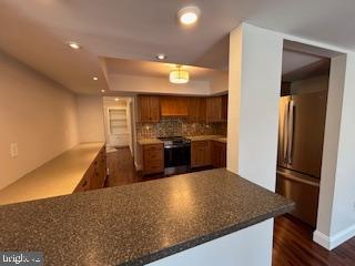 338 Dorset Court Doylestown, PA 18901 - Photo 11 of 27 a kitchen with stainless steel appliances granite countertop a refrigerator and a sink