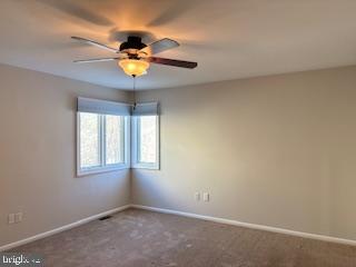 338 Dorset Court Doylestown, PA 18901 - Photo 17 of 27 an empty room with a window and a chandelier fan