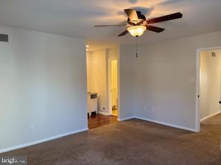 338 Dorset Court Doylestown, PA 18901 - Photo 18 of 27 an empty room with closet and a chandelier fan