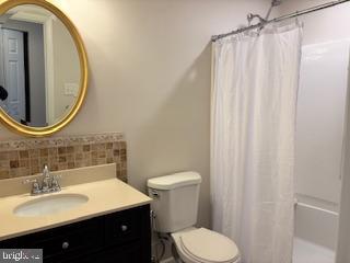 338 Dorset Court Doylestown, PA 18901 - Photo 24 of 27 a bathroom with a sink vanity mirror and toilet