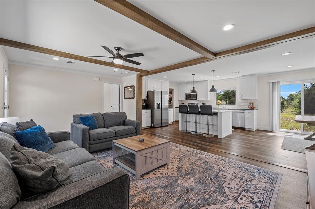 3050 Clater Powell Road Waco, TX 76705 - Photo 2 of 39 a living room with furniture and kitchen view