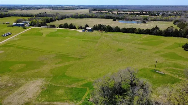 a view of a golf course with a big yard