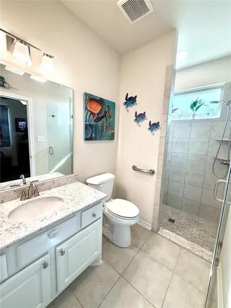 a room with a sink and a mirror