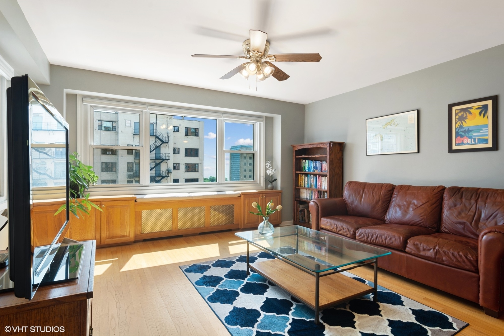 2909 North Sheridan Road, Unit 1402 Chicago, IL 60657 - Photo 3 of 15 a living room with furniture and a large window