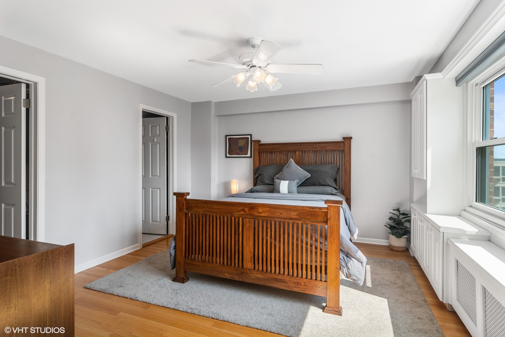 2909 North Sheridan Road, Unit 1402 Chicago, IL 60657 - Photo 10 of 15 a bedroom with a bed and window