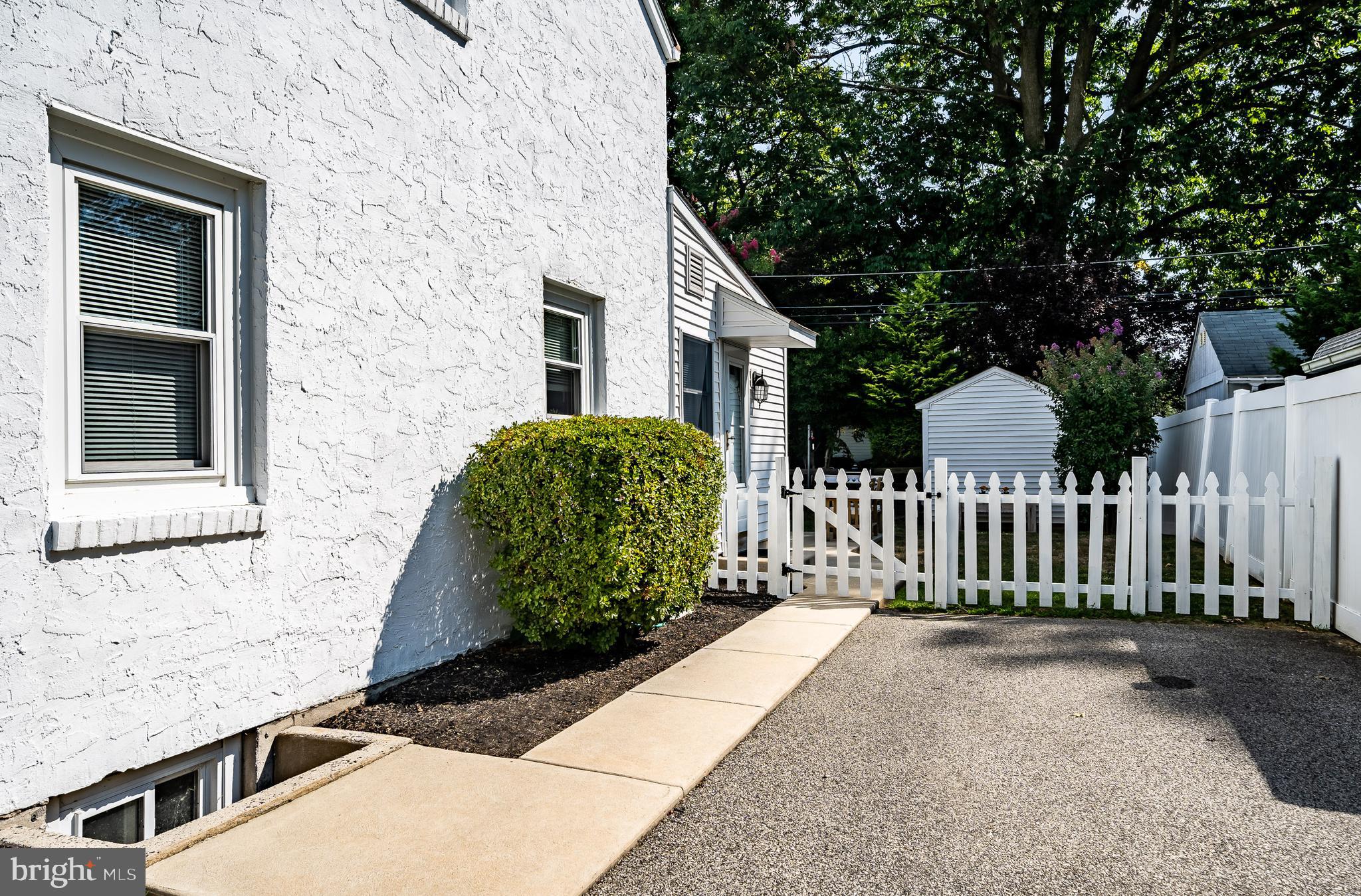 876 Cricket Road Secane, PA 19018 - Photo 29 of 37 Driveway side shot and fenced yard