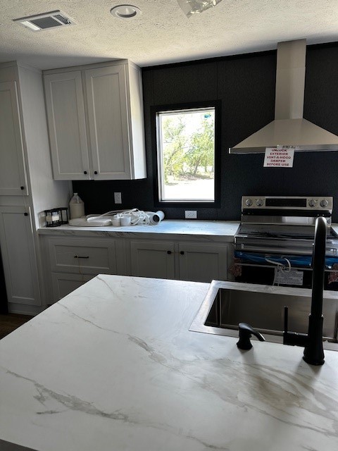 14318 Hughes Road Guy, TX 77444 - Photo 16 of 42 a kitchen with a stove and a microwave