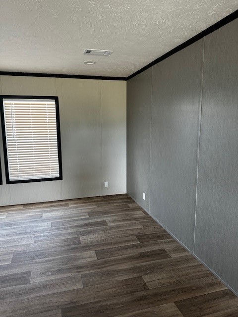 14318 Hughes Road Guy, TX 77444 - Photo 21 of 42 a view of an empty room with wooden floor and a window