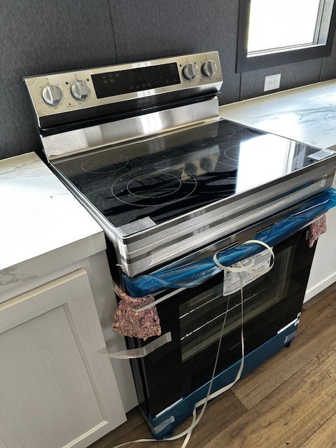 14318 Hughes Road Guy, TX 77444 - Photo 24 of 42 a stove top oven sitting inside of a kitchen