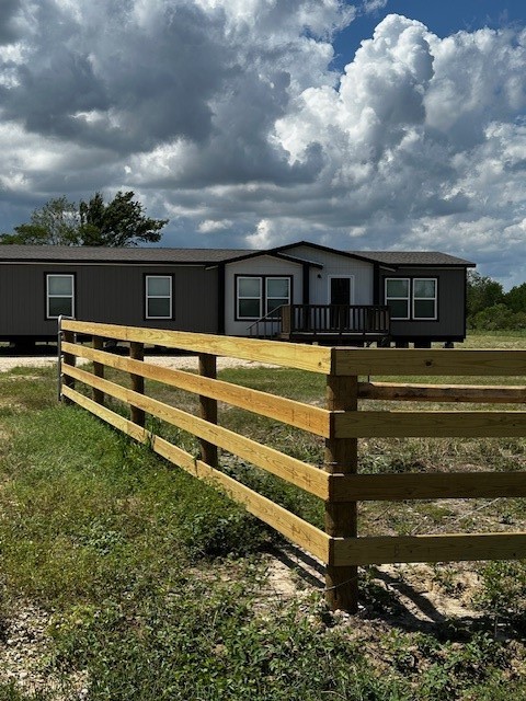 14318 Hughes Road Guy, TX 77444 - Photo 39 of 42 a view of a house with a yard