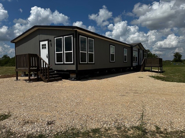 14318 Hughes Road Guy, TX 77444 - Photo 4 of 42 a front view of a house with a yard