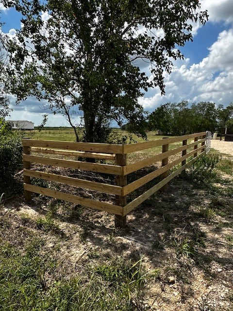 14318 Hughes Road Guy, TX 77444 - Photo 5 of 42 a view of a yard with wooden fence