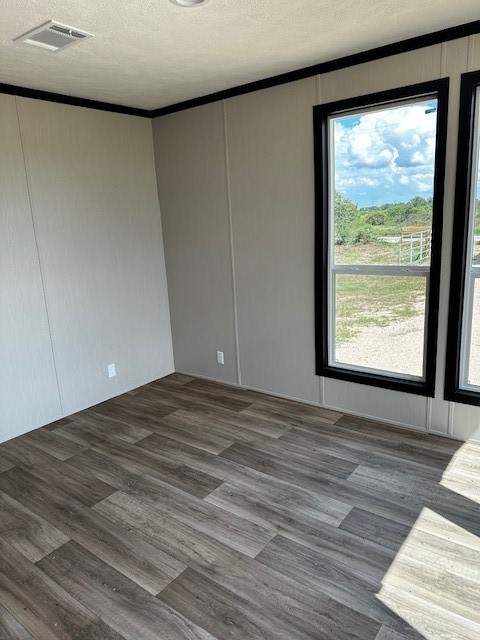 14318 Hughes Road Guy, TX 77444 - Photo 7 of 42 a view of an empty room with wooden floor and a window