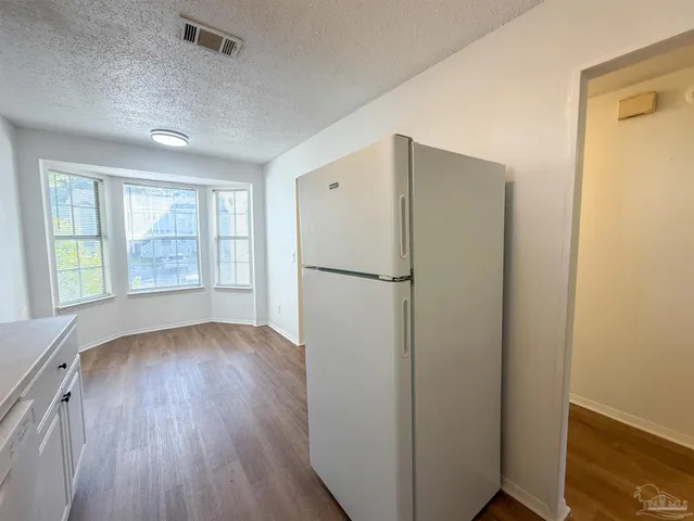 a view of a bathroom with wooden floor