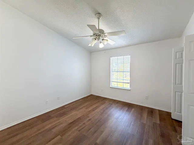 a bathroom with a granite countertop sink and mirror