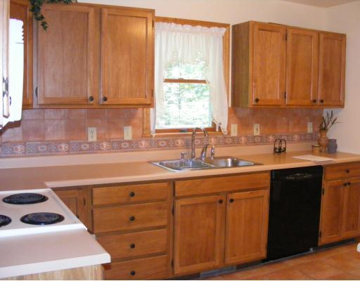 2031 Alamae Lakes Road Washington, PA 15301 - Photo 5 of 16 Kitchen. The kitchen features brand new ceramic backsplash and ceramic tile floors. Stainless sink is sparkling! Water is currently well but Public Water is available if you prefer to connect.