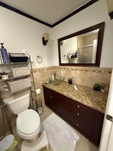 a bathroom with a shower and toilet