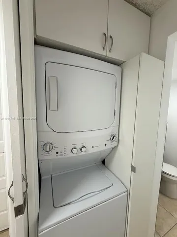 a bathroom with a toilet a sink and a shower