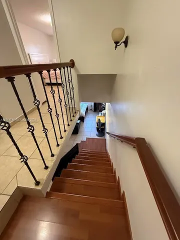 a view of staircase with white walls