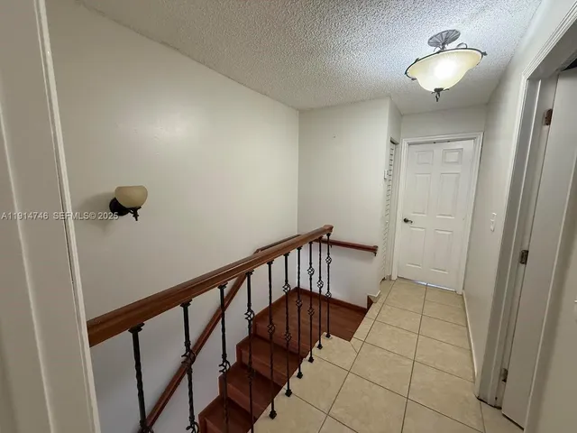 a view of hallway with stairs