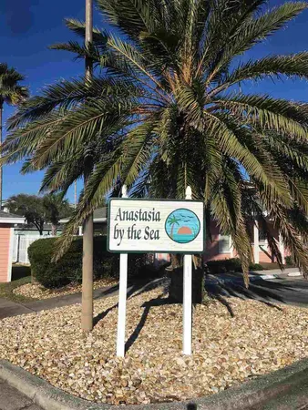 a view of a street with sign board