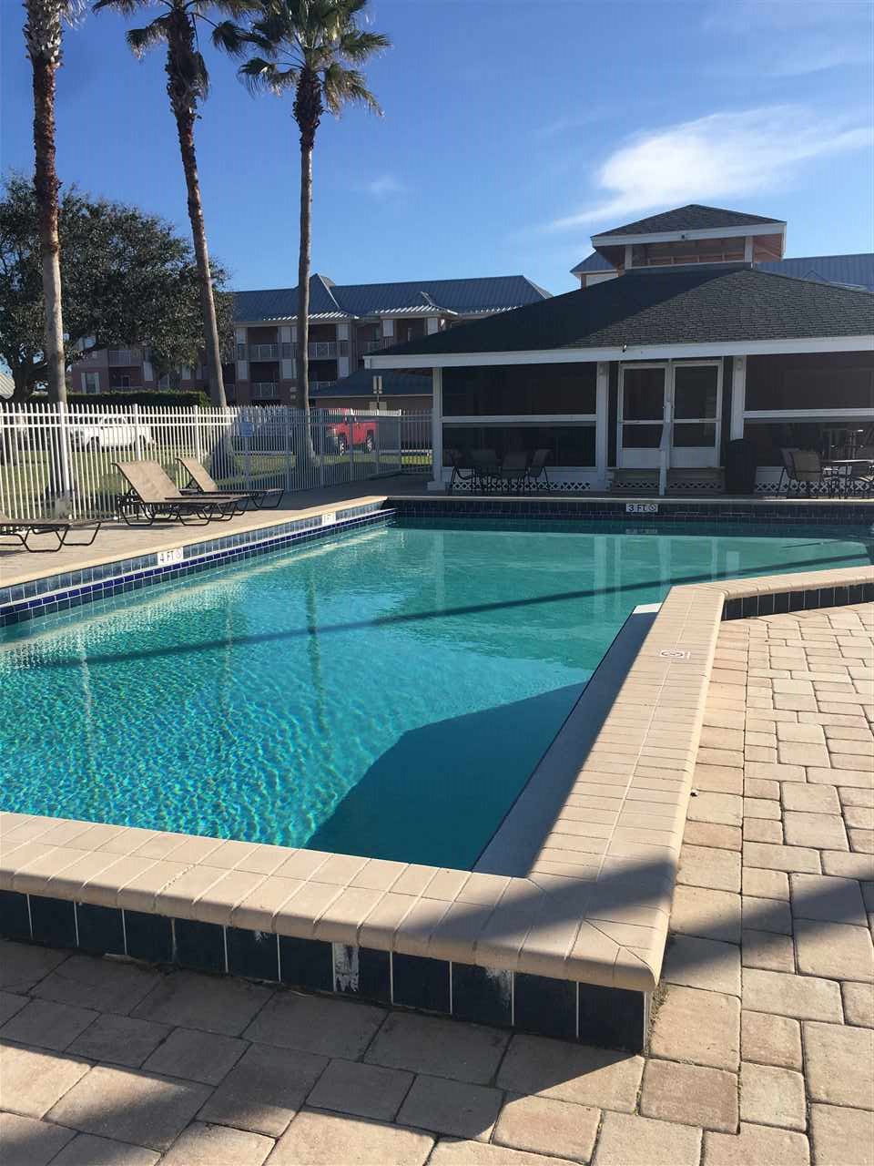 210 16th Street, Unit B St. Augustine, FL 32080 - Photo 4 of 12 a view of swimming pool with a yard